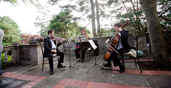 Here is talented Wellington Music, playing outside on the stone patio, for a Toronto wedding ceremony. This is the stunning view of Graydon Hall Manor, outside the main house. Picture by Ikonica.